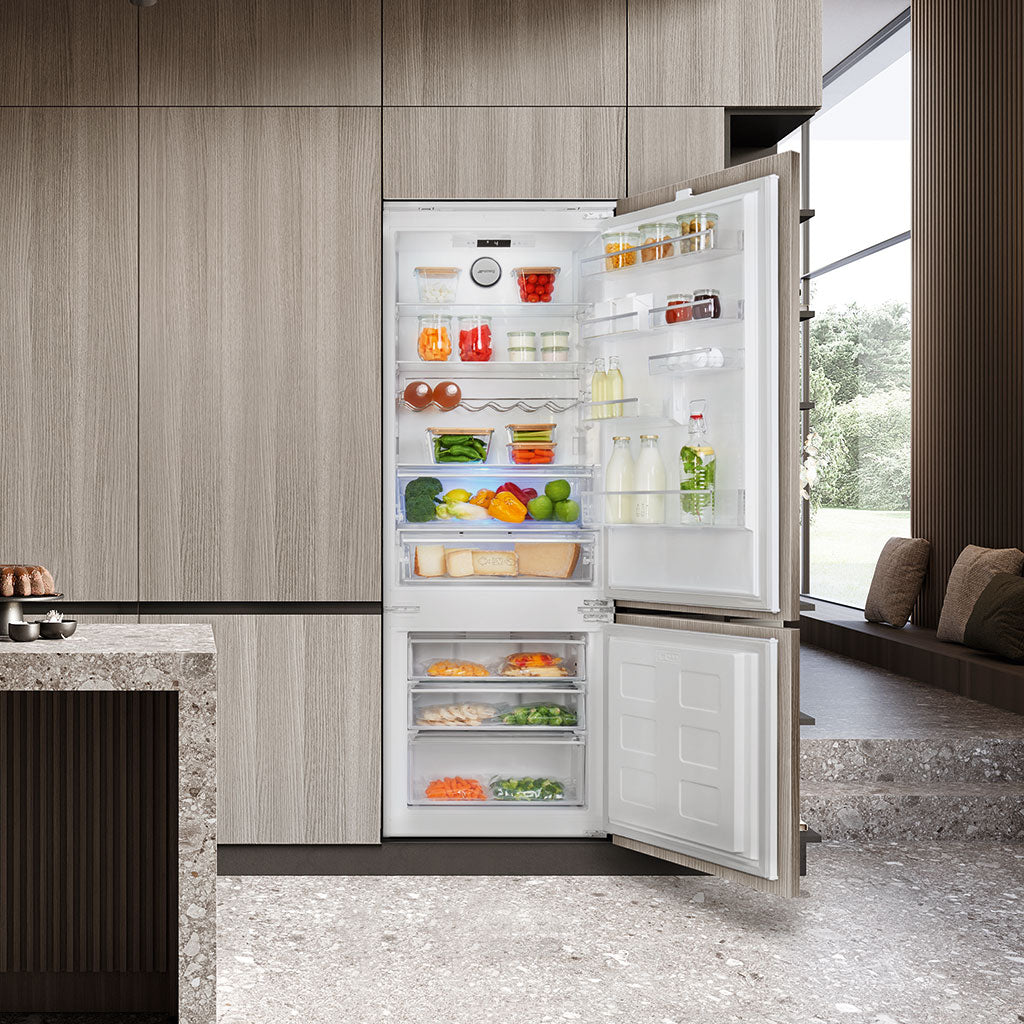 Modern refrigerator with open doors displaying various food items in a kitchen setting.