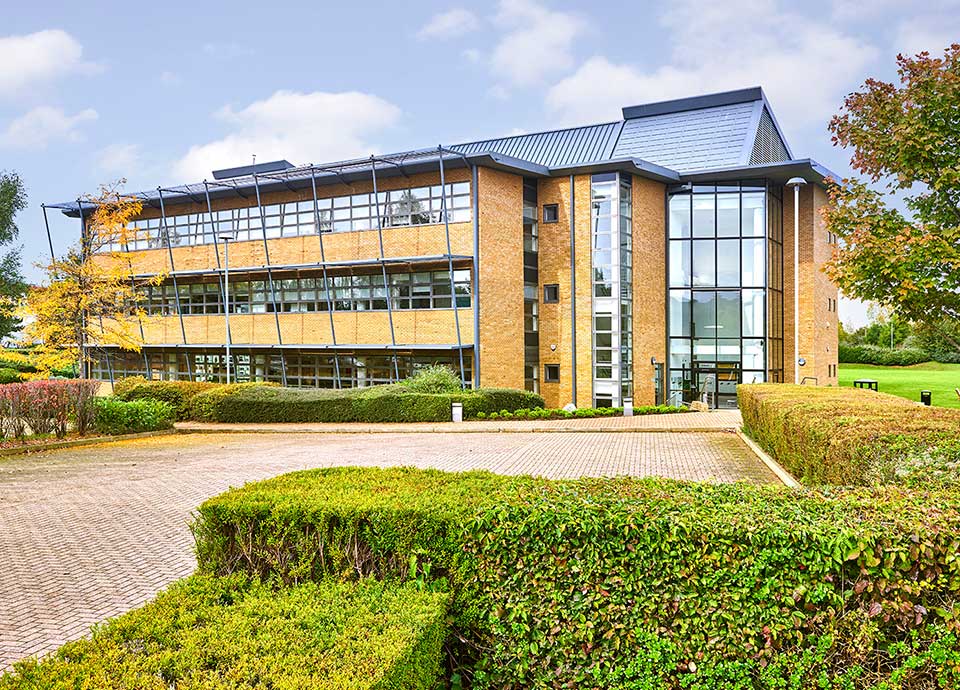 Smeg UK headquarters building surrounded by greenery