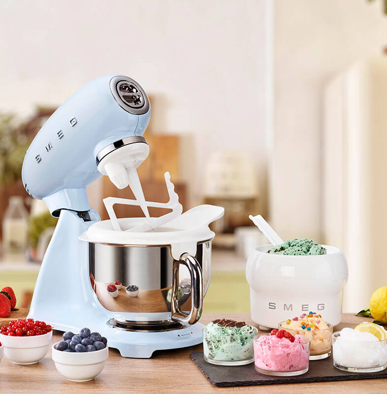 Blue Smeg stand mixer with ice cream and ingredients on a kitchen counter